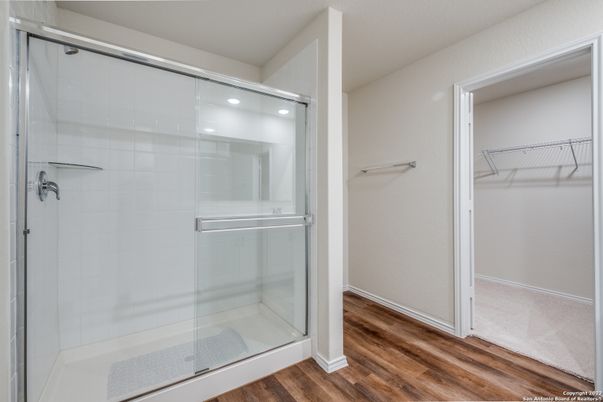 Bathroom, Glass Shower, Interior, Recessed Lighting, Walk-in Closets, Wood Texture Flooring