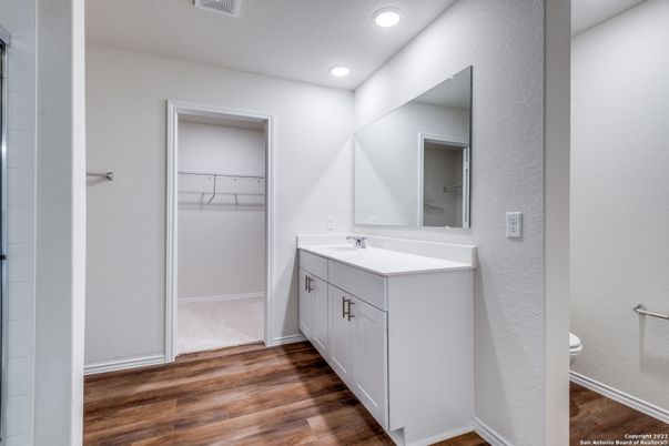 Bathroom, Dual Sink Vanities, Interior, Recessed Lighting, Walk-in Closets, Wood Texture Flooring