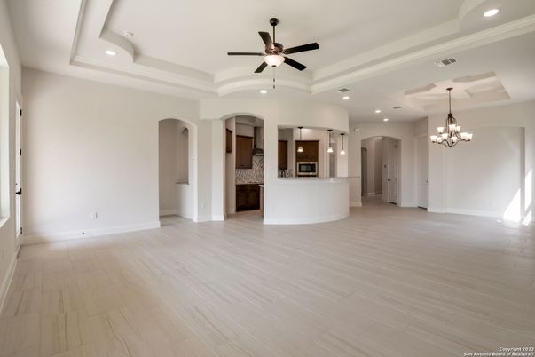 Chandelier, Empty room, Interior, Kitchen, Recessed Lighting, Stainless Steel Appliances, Wood Texture Flooring