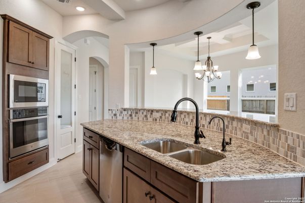 Chandelier, Interior, Kitchen, Pendant Lights, Recessed Lighting, Stainless Steel Appliances, Wood Texture Flooring