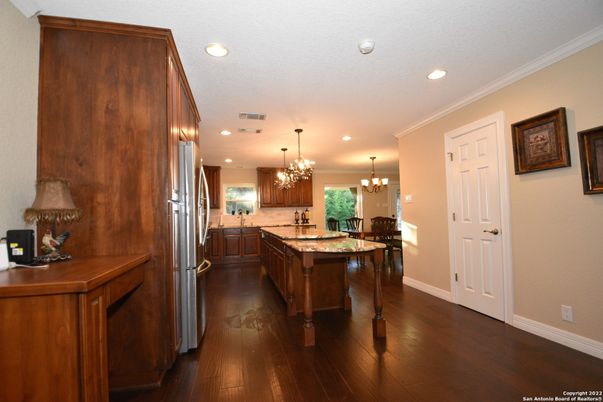 Chandelier, Dining room, Interior, Kitchen, Recessed Lighting, Stainless Steel Appliances, Wood Texture Flooring
