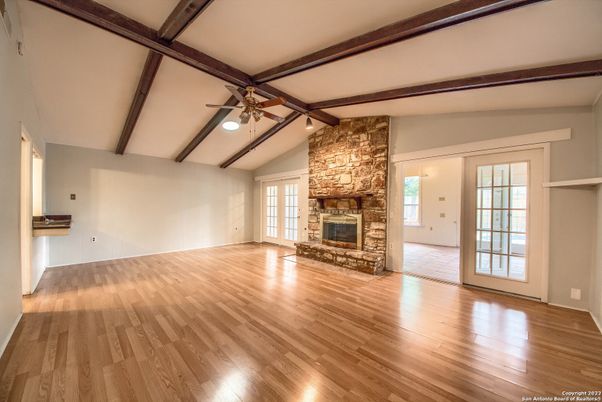 Empty room, Fireplace, Interior, Stone Walls, Wooden Beams, Wood Texture Flooring