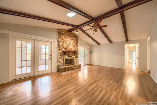 Empty room, Fireplace, Interior, Stone Walls, Wooden Beams, Wood Texture Flooring