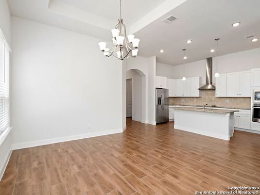Chandelier, Interior, Kitchen, Pendant Lights, Recessed Lighting, Stainless Steel Appliances, Wood Texture Flooring