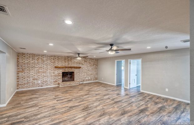 Empty room, Fireplace, Interior, Recessed Lighting, Stone Walls, Wood Texture Flooring
