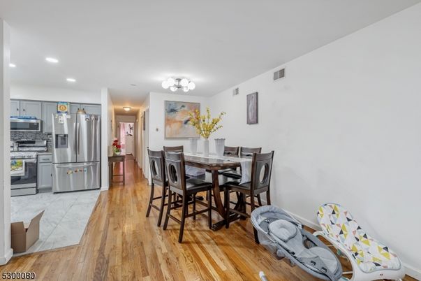 Dining room, Interior, Kitchen, Recessed Lighting, Stainless Steel Appliances, Wood Texture Flooring
