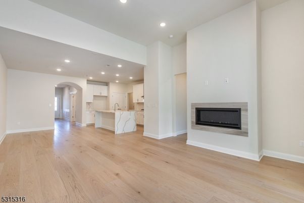 Empty room, Fireplace, Interior, Kitchen, Recessed Lighting, Wood Texture Flooring