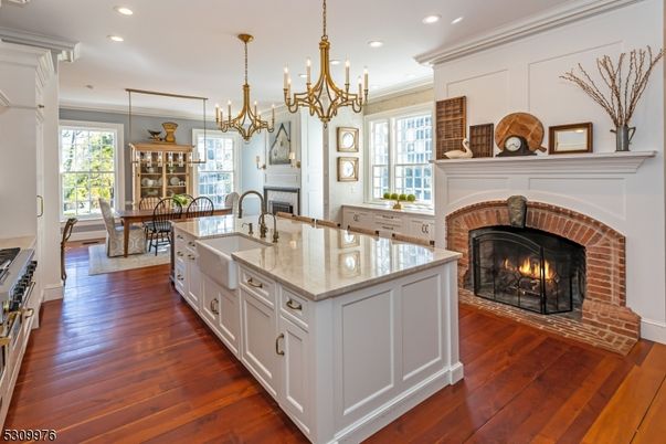 Chandelier, Dining room, Fireplace, Interior, Kitchen, Recessed Lighting, Wood Texture Flooring