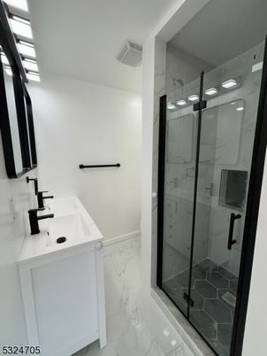 Bathroom, Dual Sink Vanities, Glass Shower, Interior, Marble, Marble Walls