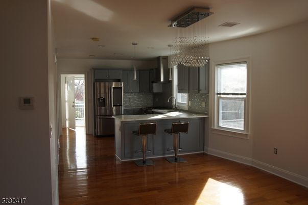 Chandelier, Interior, Kitchen, Pendant Lights, Recessed Lighting, Stainless Steel Appliances, Wood Texture Flooring