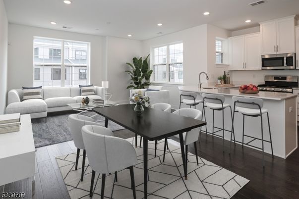 Dining room, Interior, Kitchen, Living room, Recessed Lighting, Stainless Steel Appliances, Wood Texture Flooring