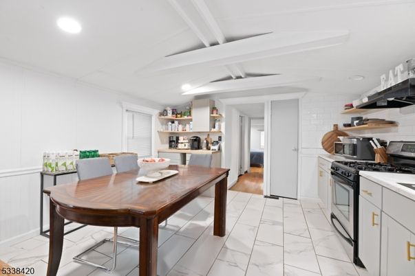 Dining room, Interior, Kitchen, Marble, Recessed Lighting, Stainless Steel Appliances, Wood Texture Flooring
