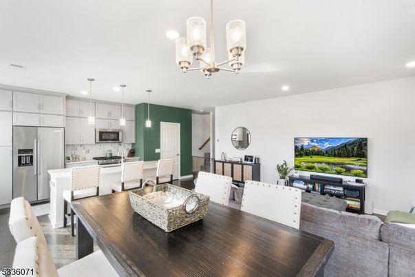Chandelier, Dining room, Interior, Kitchen, Living room, Pendant Lights, Recessed Lighting, Stainless Steel Appliances