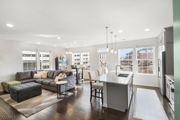 Chandelier, Dining room, Interior, Kitchen, Living room, Pendant Lights, Recessed Lighting, Stainless Steel Appliances, Wood Texture Flooring
