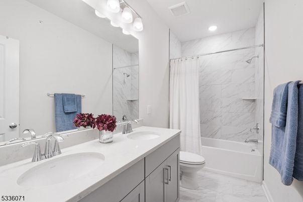 Bathroom, Dual Sink Vanities, Interior, Marble, Marble Walls, Recessed Lighting