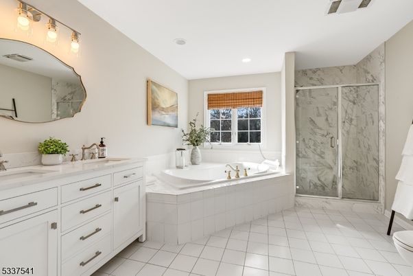 Bathroom, Dual Sink Vanities, Glass Shower, Interior, Marble Walls, Recessed Lighting