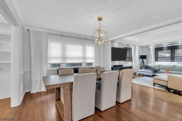 Dining room, Fireplace, Interior, Living room, Pendant Lights, Recessed Lighting, Wood Texture Flooring