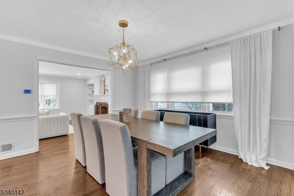 Chandelier, Dining room, Fireplace, Interior, Recessed Lighting, Wood Texture Flooring