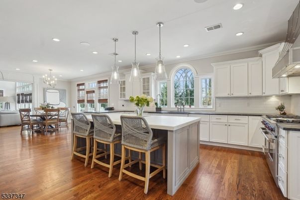 Chandelier, Dining room, Interior, Kitchen, Pendant Lights, Recessed Lighting, Stainless Steel Appliances, Wood Texture Flooring
