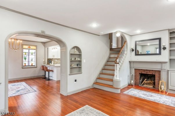 Chandelier, Fireplace, Interior, Piano, Recessed Lighting, Wood Texture Flooring