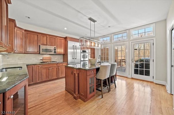 Chandelier, Interior, Kitchen, Pendant Lights, Recessed Lighting, Stainless Steel Appliances, Wood Texture Flooring