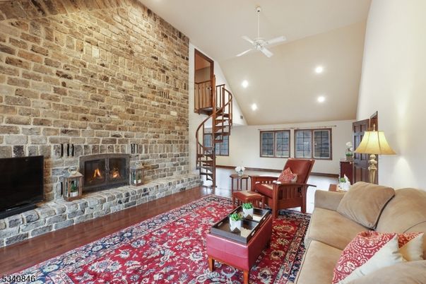 Fireplace, Interior, Living room, Recessed Lighting, Stone Walls, Wood Texture Flooring
