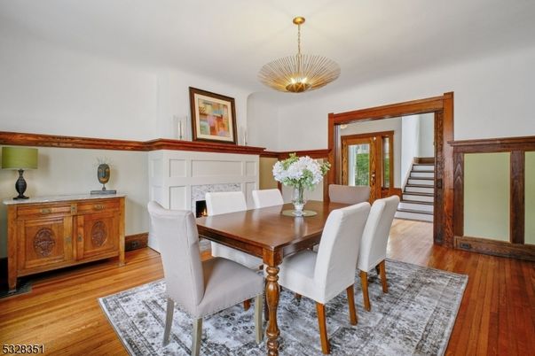 Dining room, Fireplace, Interior, Pendant Lights, Wood Texture Flooring