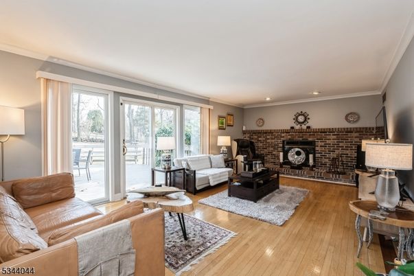 Fireplace, Interior, Living room, Recessed Lighting, Stone Walls, Wood Texture Flooring