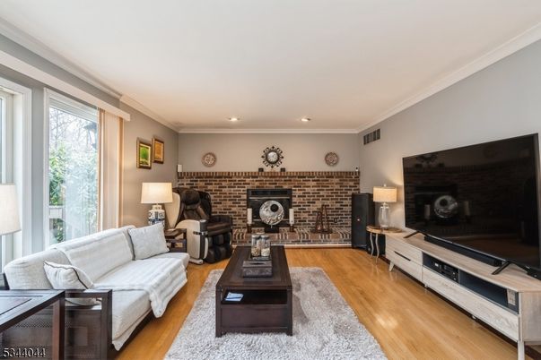 Fireplace, Interior, Living room, Recessed Lighting, Stone Walls, Wood Texture Flooring