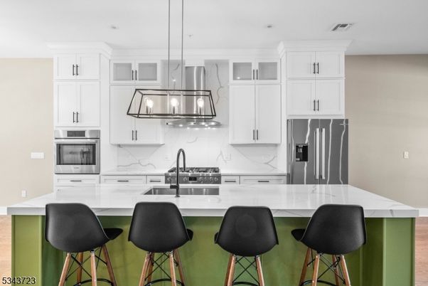 Interior, Kitchen, Marble Walls, Pendant Lights, Recessed Lighting, Stainless Steel Appliances