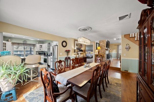 Chandelier, Dining room, Interior, Kitchen, Living room, Recessed Lighting, Stainless Steel Appliances, Wood Texture Flooring
