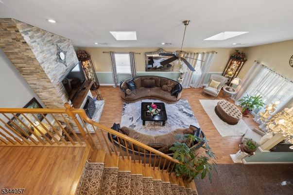 Dining room, Fireplace, Interior, Living room, Pendant Lights, Recessed Lighting, Stone Walls, Wood Texture Flooring