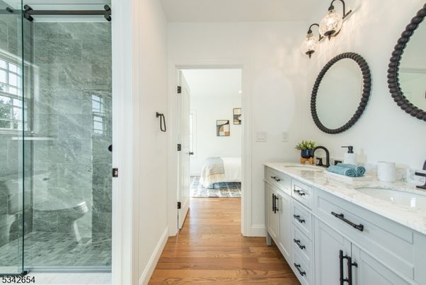 Bathroom, Bedroom, Dual Sink Vanities, Glass Shower, Interior, Marble Walls, Wood Texture Flooring