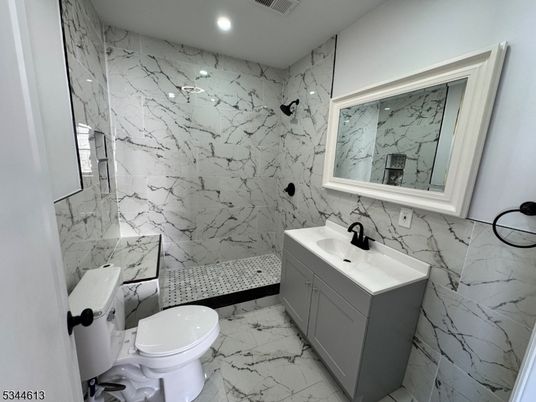 Bathroom, Dual Sink Vanities, Interior, Marble, Marble Walls, Recessed Lighting