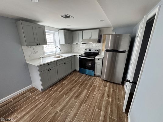 Interior, Kitchen, Marble Walls, Recessed Lighting, Stainless Steel Appliances, Wood Texture Flooring
