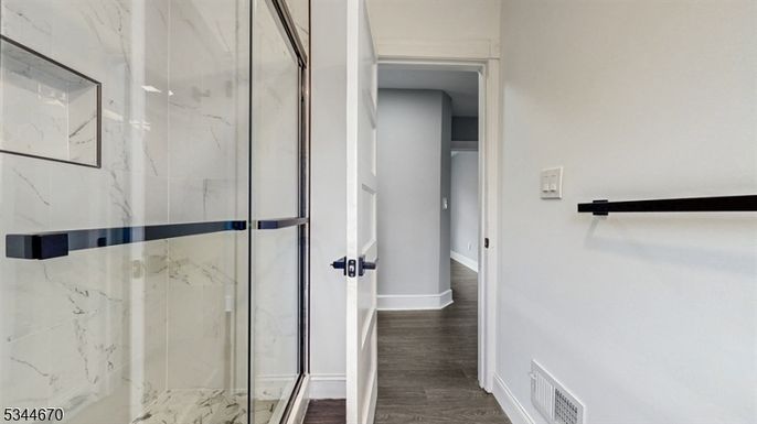 Bathroom, Glass Shower, Interior, Marble Walls, Wood Texture Flooring