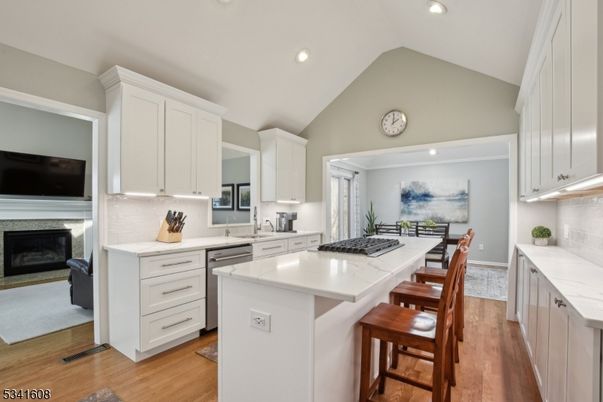 Fireplace, Interior, Kitchen, Recessed Lighting, Stainless Steel Appliances, Wood Texture Flooring
