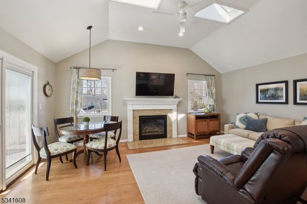 Dining room, Fireplace, Interior, Living room, Pendant Lights, Recessed Lighting, Wood Texture Flooring