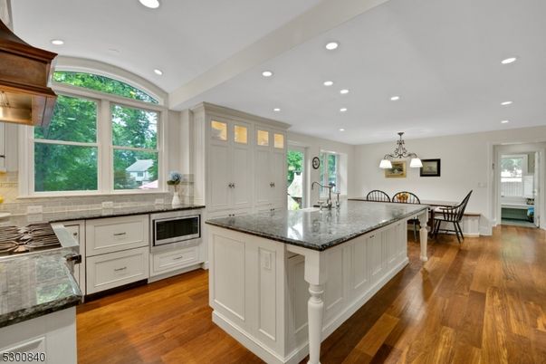 Chandelier, Dining room, Interior, Kitchen, Recessed Lighting, Stainless Steel Appliances, Wood Texture Flooring