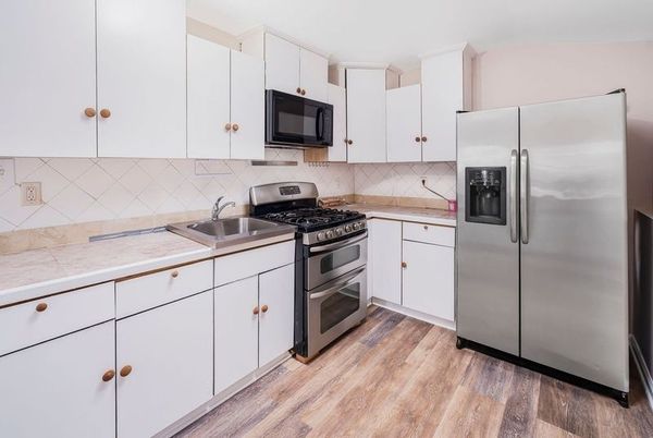 Interior, Kitchen, Stainless Steel Appliances, Tile Countertops, Wood Texture Flooring