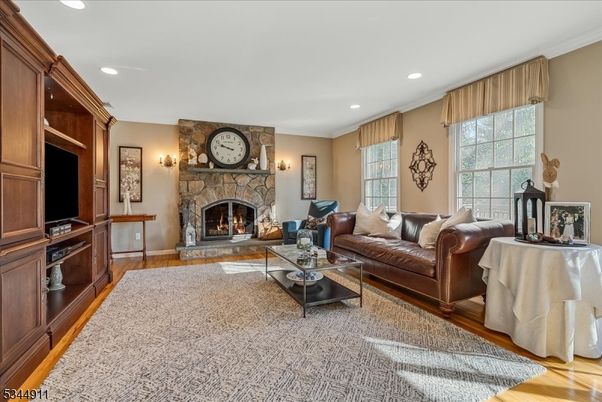 Fireplace, Interior, Living room, Recessed Lighting, Stone Walls, Wood Texture Flooring