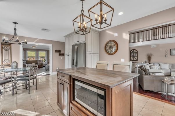 Chandelier, Dining room, Interior, Kitchen, Living room, Recessed Lighting, Stainless Steel Appliances, Wood Texture Flooring
