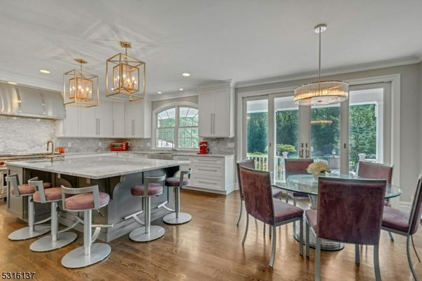 Chandelier, Dining room, Interior, Kitchen, Pendant Lights, Recessed Lighting, Stainless Steel Appliances, Wood Texture Flooring