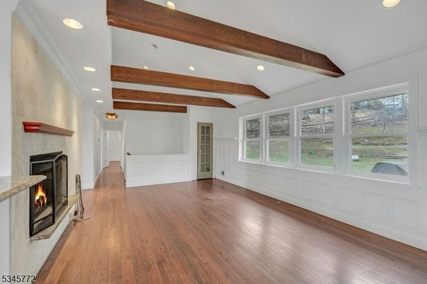 Empty room, Fireplace, Interior, Recessed Lighting, Wooden Beams, Wood Texture Flooring