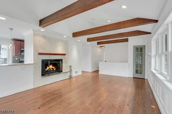 Empty room, Fireplace, Interior, Pendant Lights, Recessed Lighting, Wooden Beams, Wood Texture Flooring