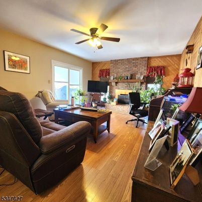 Fireplace, Home Office, Interior, Living room, Stone Walls, Wood Texture Flooring