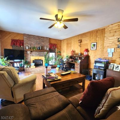 Fireplace, Interior, Living room, Stone Walls, Wood Texture Flooring, Wooden Walls