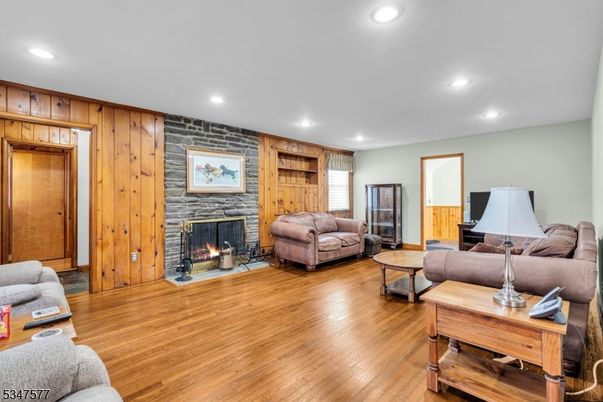 Fireplace, Interior, Living room, Recessed Lighting, Stone Walls, Wood Texture Flooring, Wooden Walls