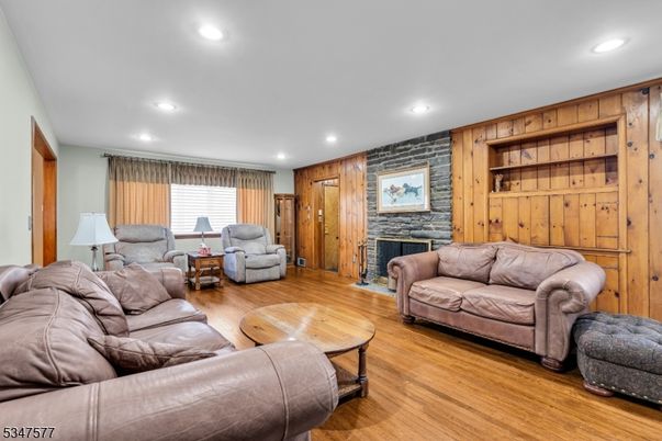 Fireplace, Interior, Living room, Recessed Lighting, Wood Texture Flooring, Wooden Walls