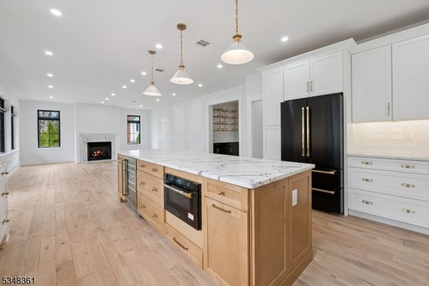 Fireplace, Interior, Kitchen, Pendant Lights, Recessed Lighting, Stainless Steel Appliances, Wood Texture Flooring